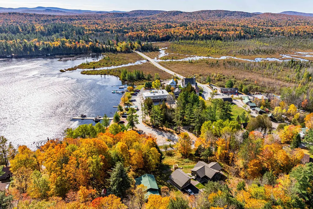 Aerial view of the hamlet of Raquette Lake, its harbor and the marsh beyond